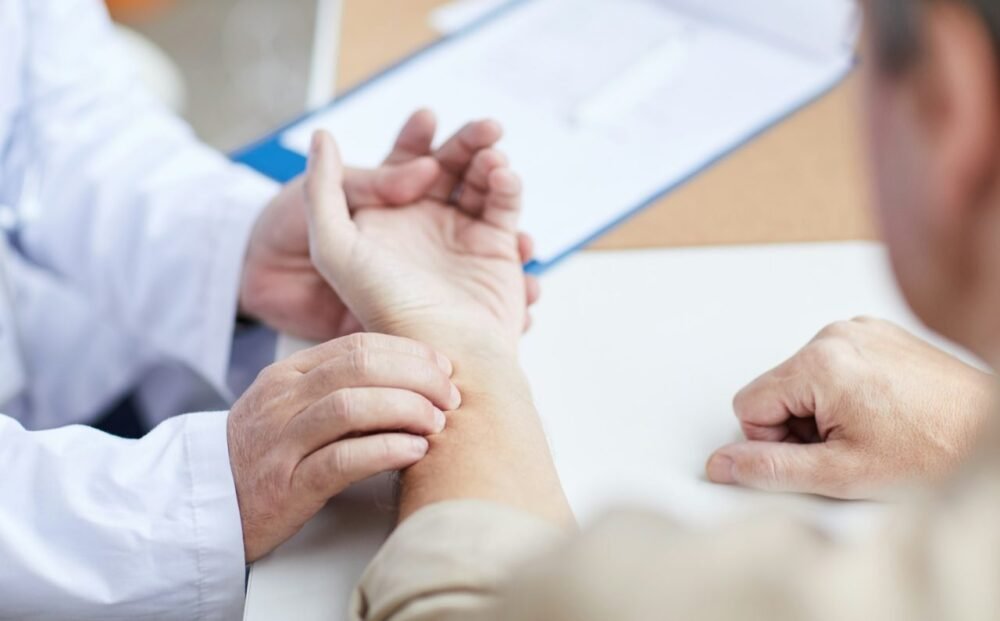 doctor-checking-patients-pulse-with-hand.jpg