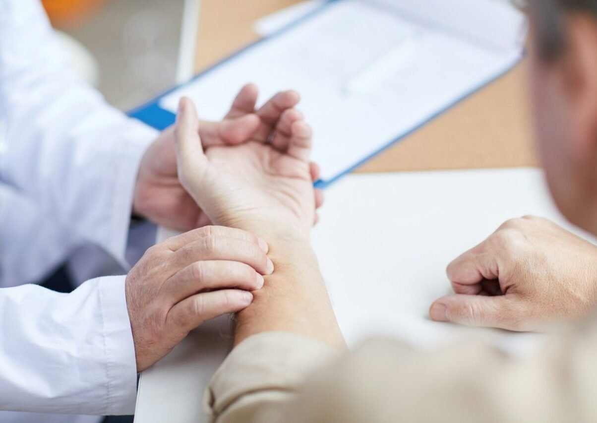 doctor-checking-patients-pulse-with-hand.jpg