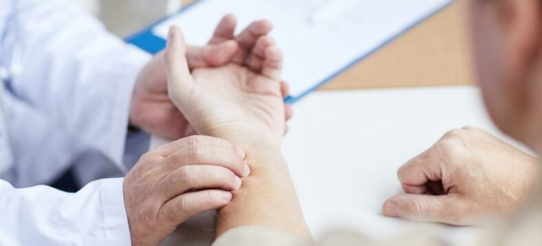 doctor-checking-patients-pulse-with-hand.jpg